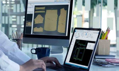 Fashion designer sketching garment concepts using CAD software